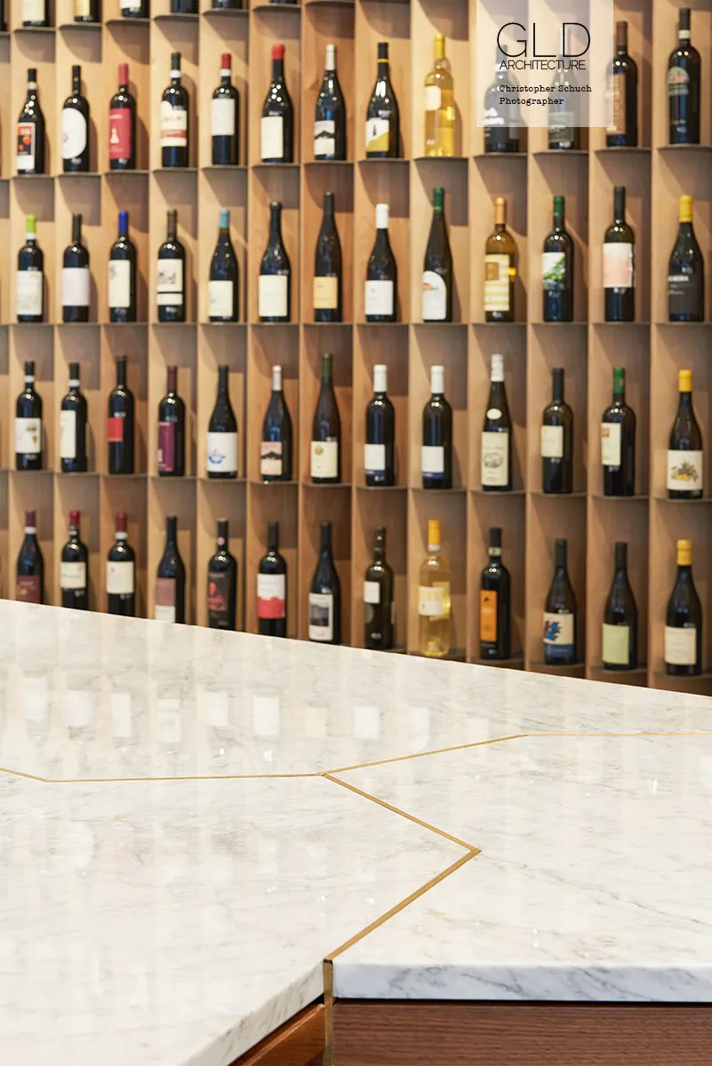 Marble against timber slots, each bottle on its own.