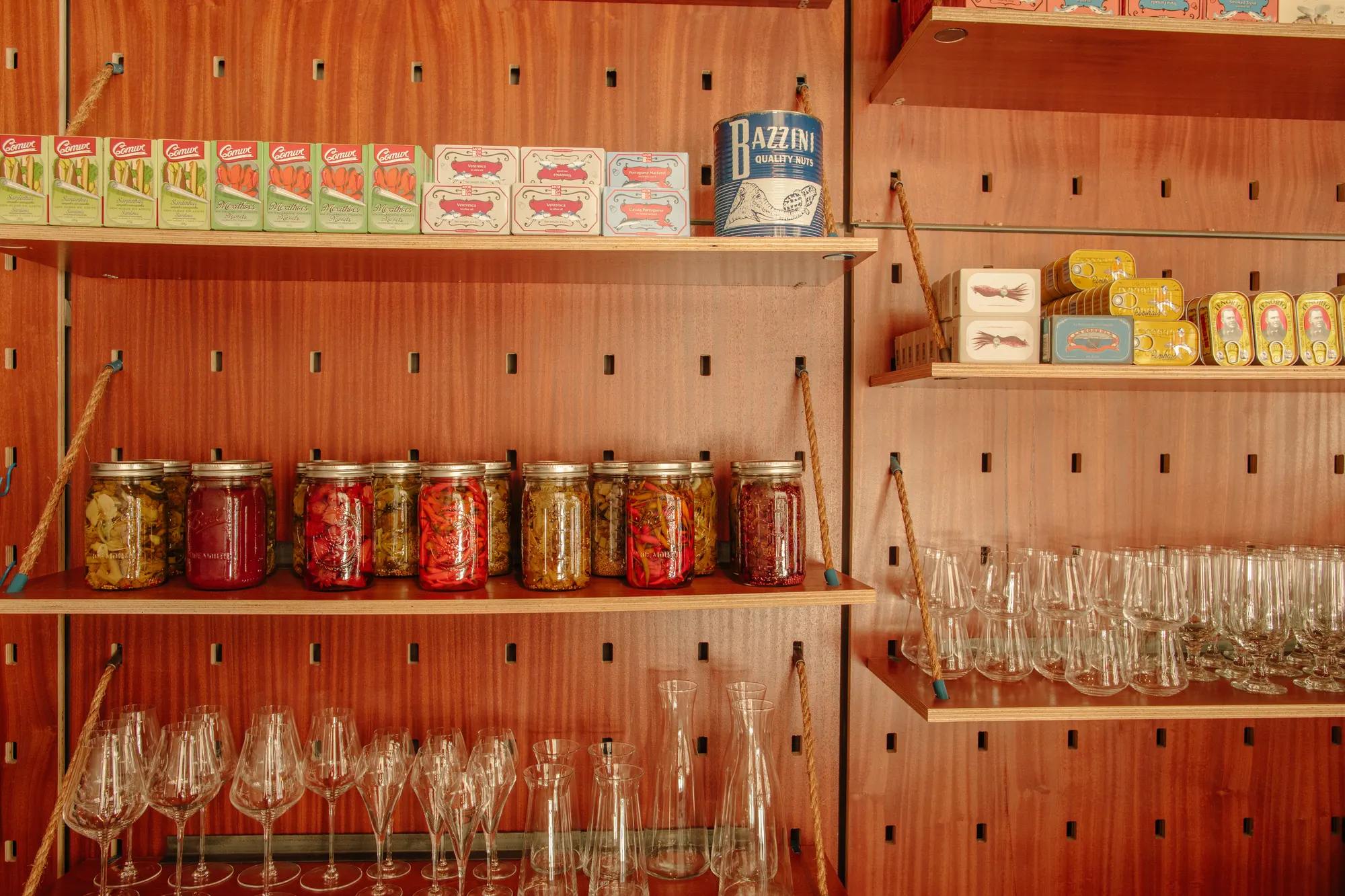 Every shelf sits on pegs, so the wall is set out to whatever is on it rather than the other way round.