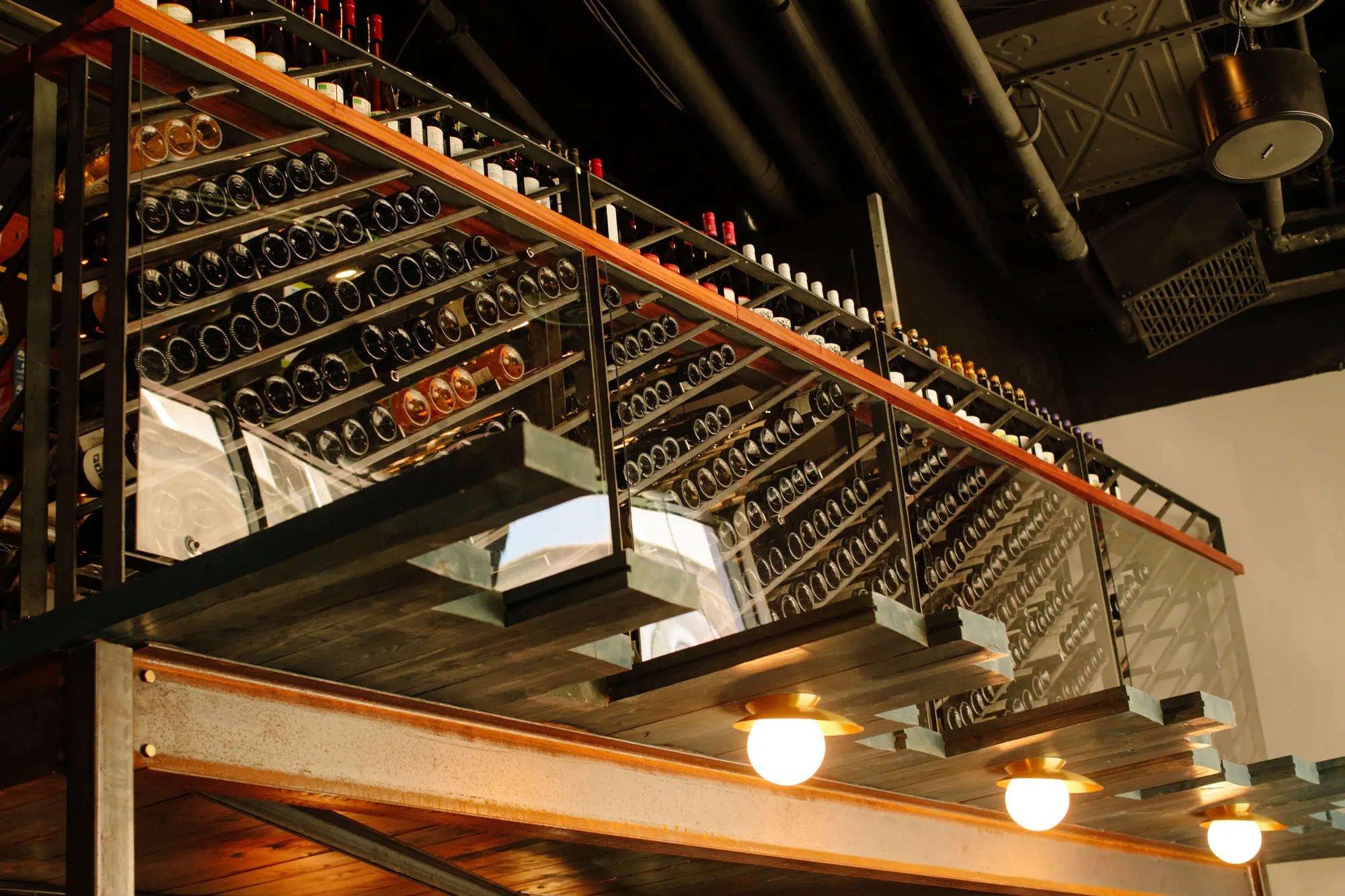 Racking carried over the bar, with the pendants hung below it.