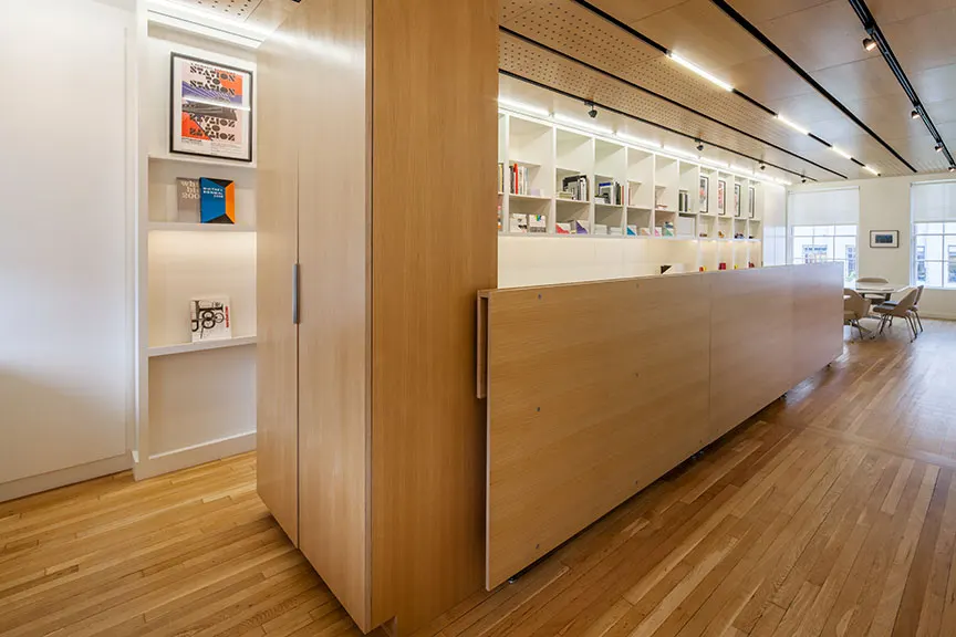 A timber-faced partition, closing one room off from the next.